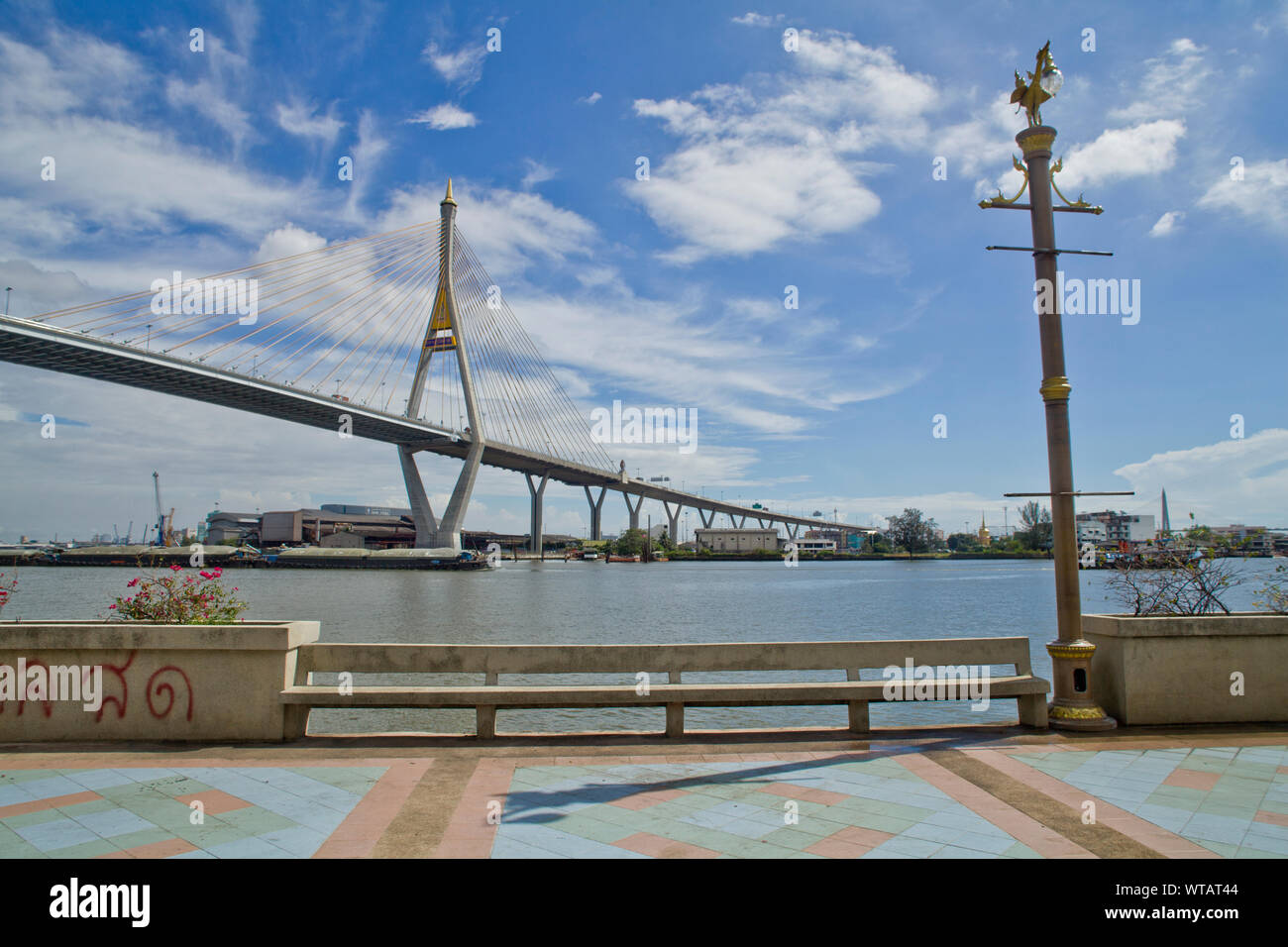 Sidewalk in the Chao Phraya riverside and Bangkok`s Mega Bridge Stock Photo